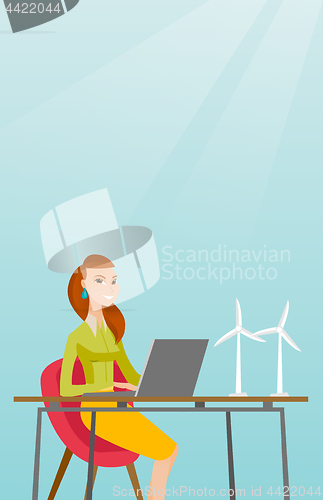 Image of Woman working with model of wind turbines.