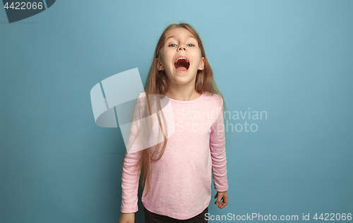 Image of The emotional blonde teen girl have a happiness look and screaming. Studio shot