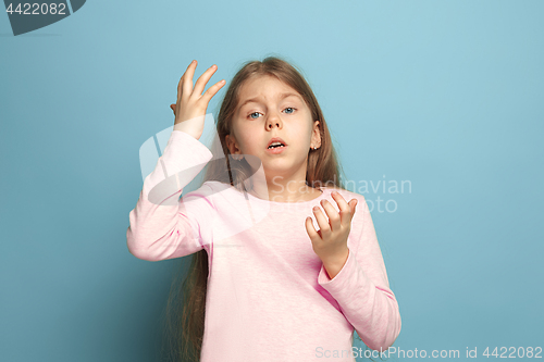 Image of The deplorable girl. Teen girl on a blue background. Facial expressions and people emotions concept