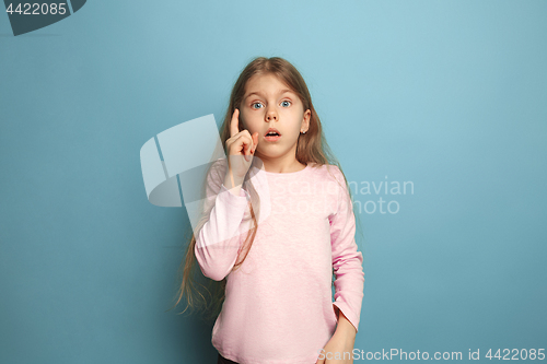 Image of The remember all. Teen girl on a blue background. Facial expressions and people emotions concept