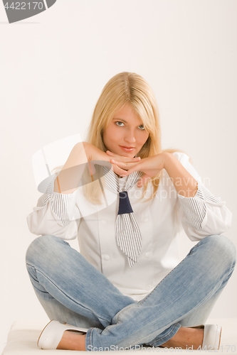 Image of Positive woman sitting cross-legged