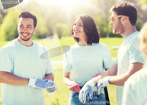 Image of group of volunteers planting tree in park