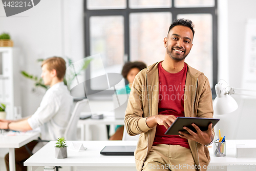 Image of indian man with tablet pc computer at office