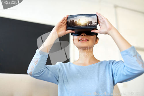 Image of happy woman with virtual reality headset