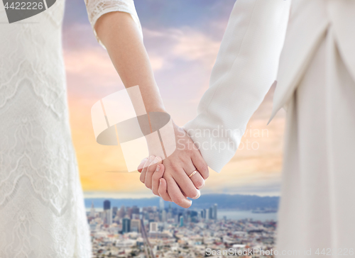 Image of close up of happy female gay couple wedding