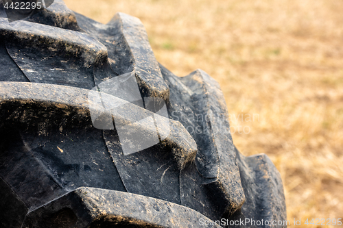 Image of Wheels of tractor plowing field