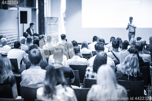 Image of Business speaker giving a talk at business conference event.