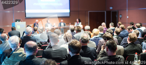 Image of Business speaker giving a talk at business conference event.