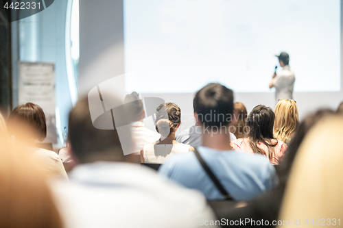 Image of Business speaker giving a talk at business conference event.