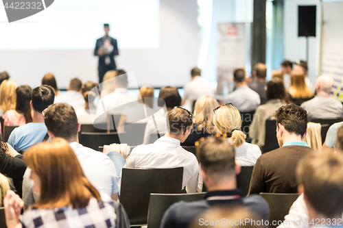 Image of Business speaker giving a talk at business conference event.