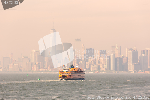 Image of Staten Island Ferry and Lower Manhattan Skyline, New York, USA.