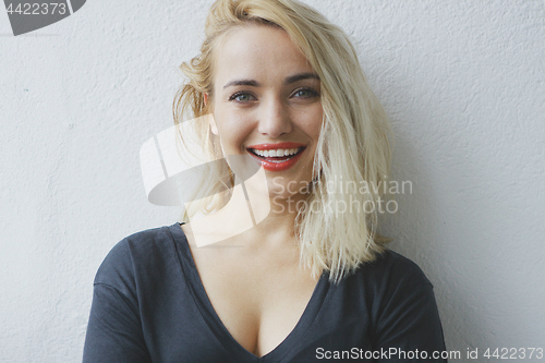 Image of Attractive cheerful young blond woman