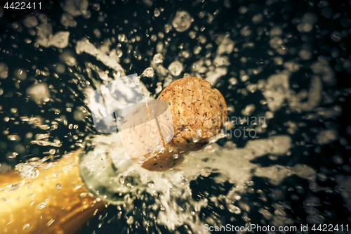 Image of a champagne cork is popping out