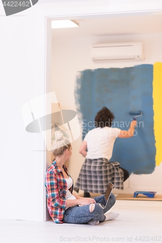 Image of Happy couple doing home renovations