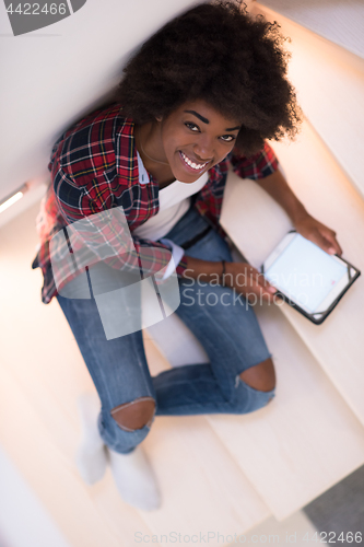 Image of black woman using her electronic tablet