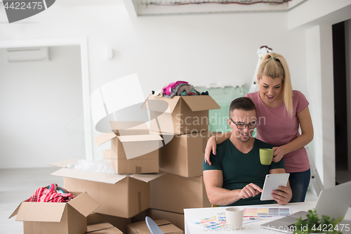 Image of Young couple moving in a new home