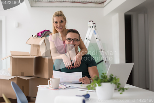 Image of Young couple moving in a new home