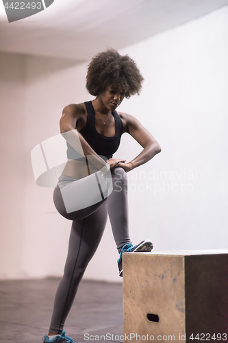 Image of black woman are preparing for box jumps at gym