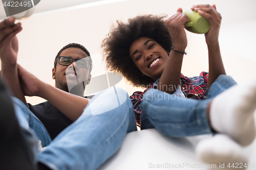 Image of couple having break during moving to new house