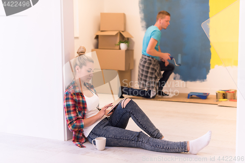 Image of couple doing home renovations