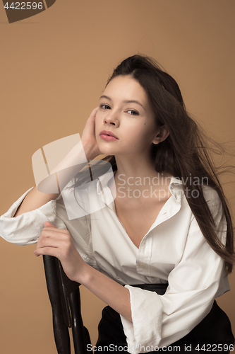 Image of Stylish young teen girl over gray background