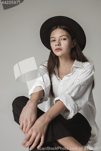 Image of Stylish young teen girl over gray background