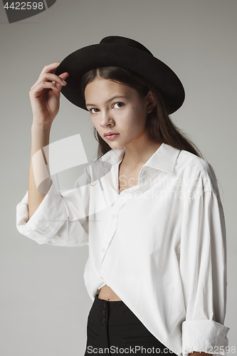 Image of Stylish young teen girl over gray background