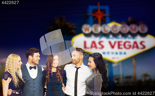 Image of friends in party clothes hugging at las vegas