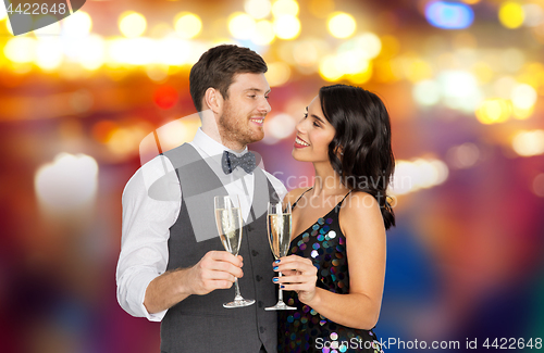 Image of happy couple with champagne glasses at party