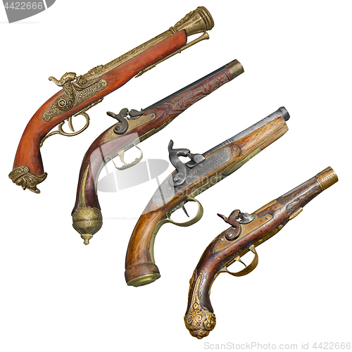 Image of Four old vintage firelock gun isolated on white background