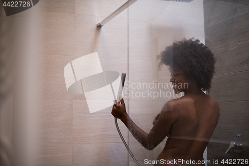 Image of African American woman in the shower