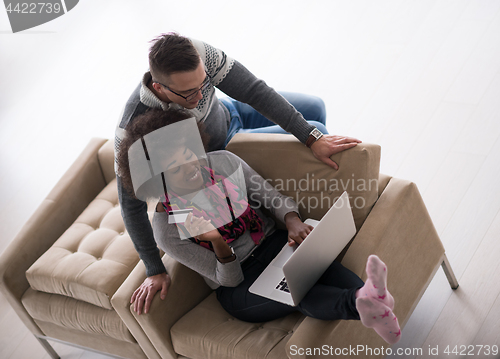 Image of multiethnic couple shopping online