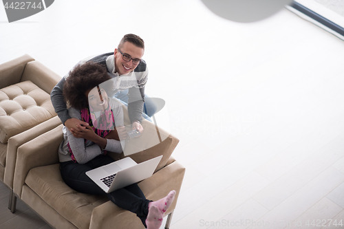 Image of multiethnic couple shopping online