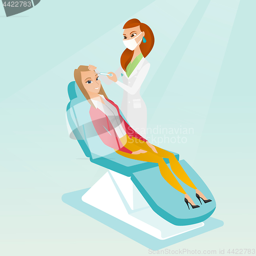 Image of Woman receiving beauty facial injections in salon.