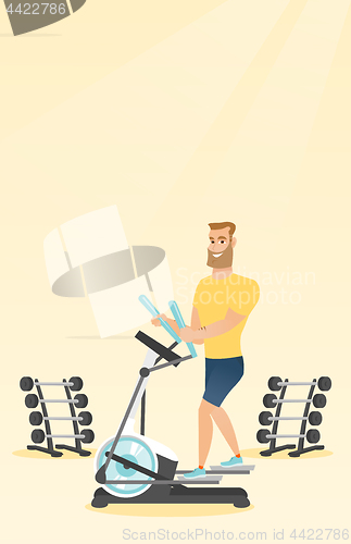 Image of Man exercising on elliptical trainer.