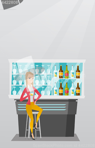 Image of Caucasian woman sitting at the bar counter.