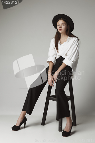 Image of Stylish young teen girl over gray background