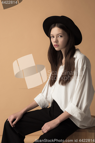 Image of Stylish young teen girl over gray background