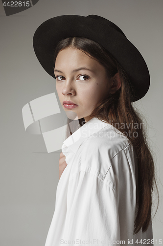 Image of Stylish young teen girl over gray background