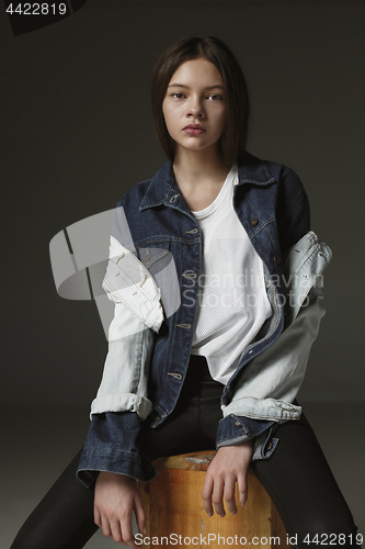 Image of Stylish young teen girl over gray background