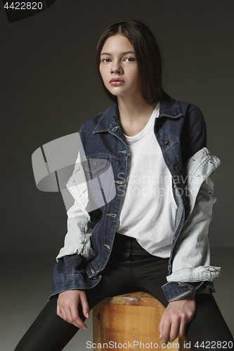 Image of Stylish young teen girl over gray background