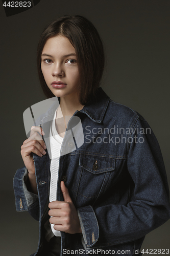 Image of Stylish young teen girl over gray background