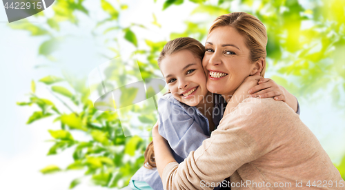 Image of happy smiling mother hugging daughter