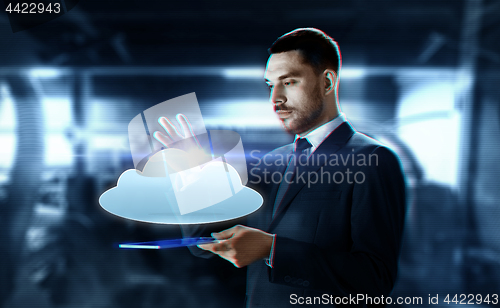 Image of businessman with transparent tablet and cloud