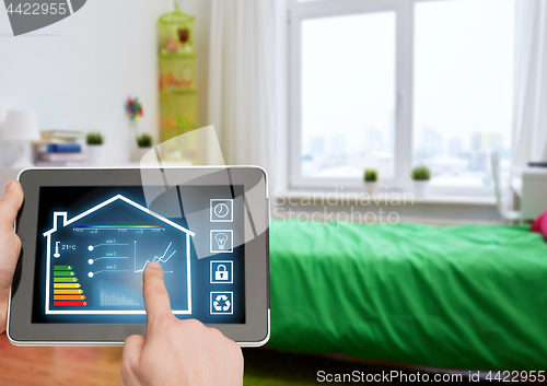 Image of tablet pc with smart home settings on screen