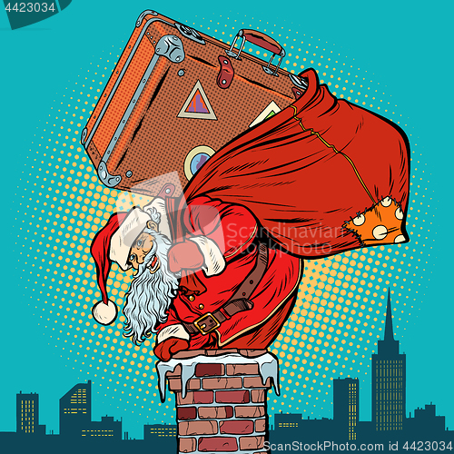 Image of Santa Claus with a suitcase climbs into the chimney