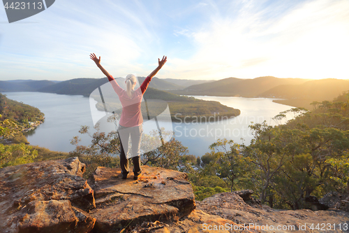 Image of Golden light cli9ff top views of river and mountain scene