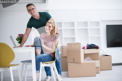 Image of Young couple moving in a new home