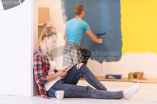 Image of couple doing home renovations