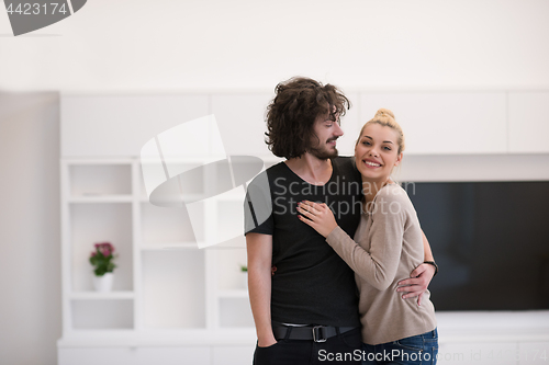 Image of couple hugging in their new home